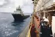 Versorgungsschiff und Offshore-Personal im Einsatz zur Unterstützung von Energie-, Wartungs- und Logistikprozessen auf See.